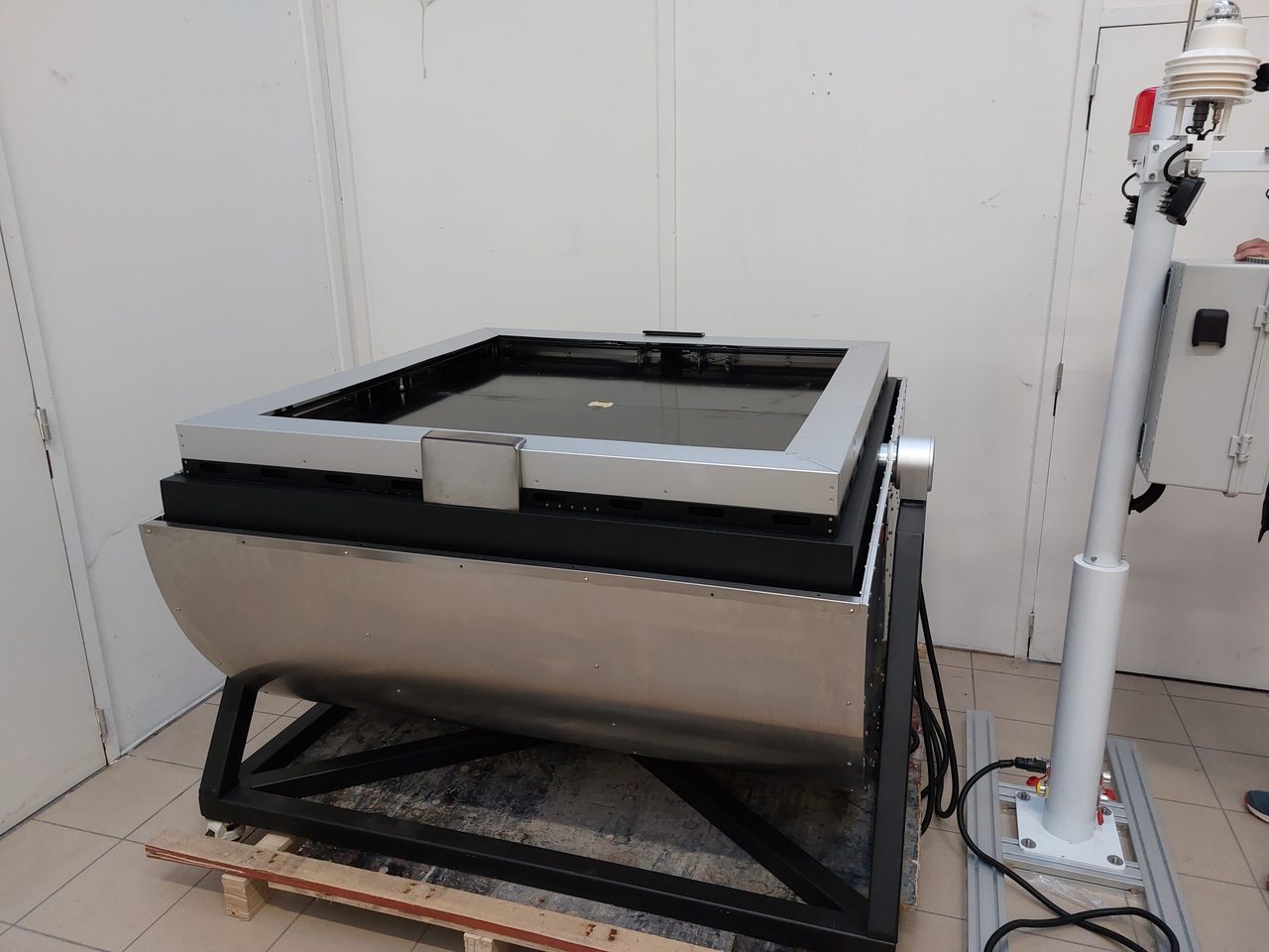 Drone-in-a-box station with weather mast during integration